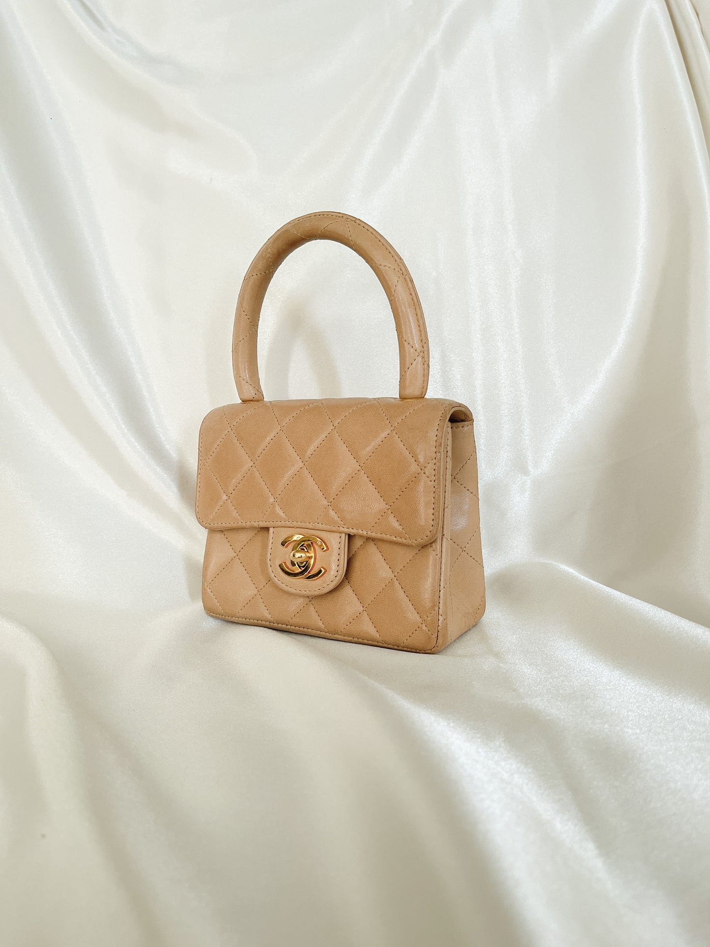 CHANEL CC LOGO TURN LOCK MICRO MINI KELLY TOP HANDLE BROWN QUILTED